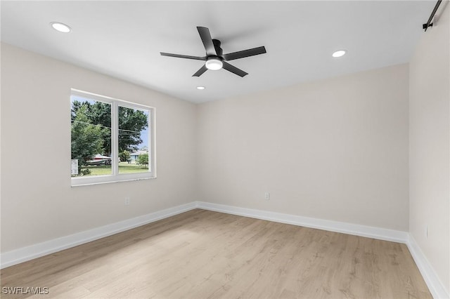 unfurnished room featuring light wood-type flooring, ceiling fan, baseboards, and recessed lighting