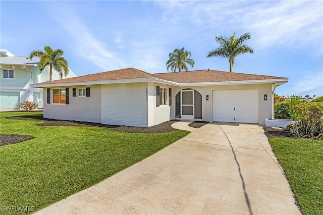 ranch-style house with a garage and a front lawn