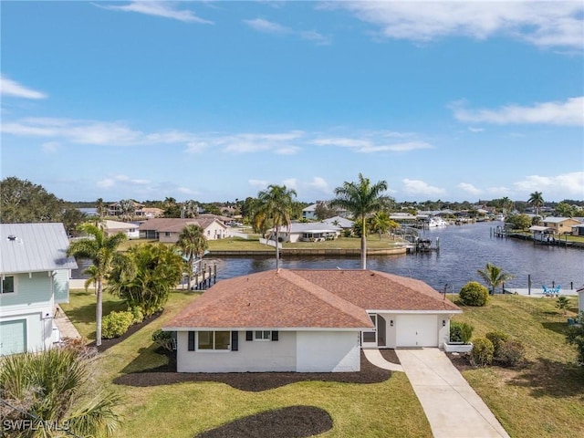 birds eye view of property with a water view