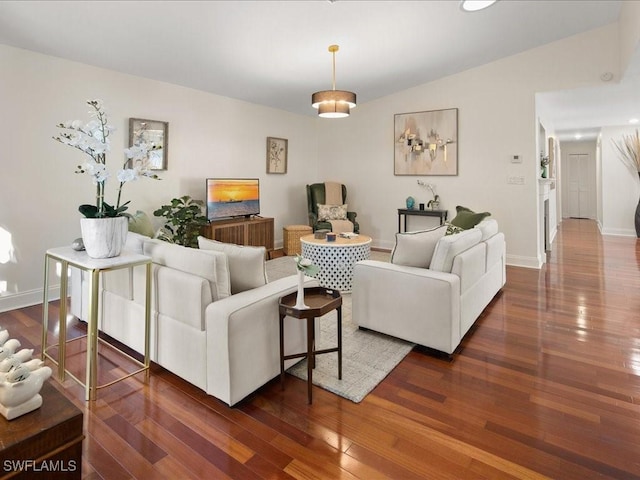 living room with lofted ceiling and dark wood-type flooring