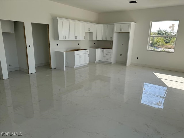 kitchen with white cabinets