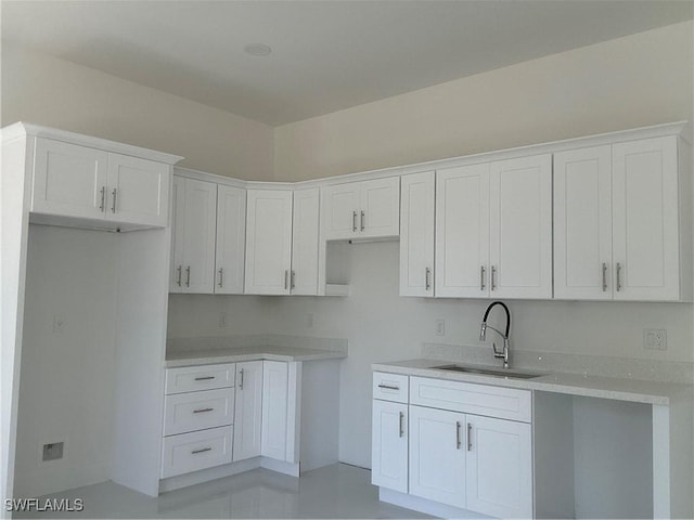 kitchen with white cabinets and a sink