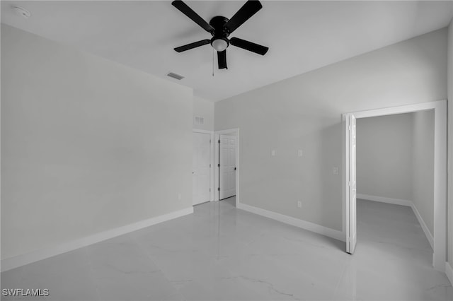 unfurnished bedroom with baseboards, light marble finish flooring, and ceiling fan