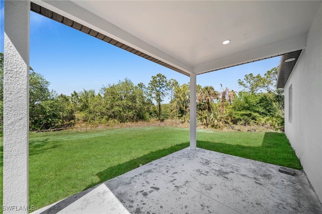 view of grassy yard featuring a patio