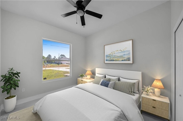 bedroom with baseboards and ceiling fan