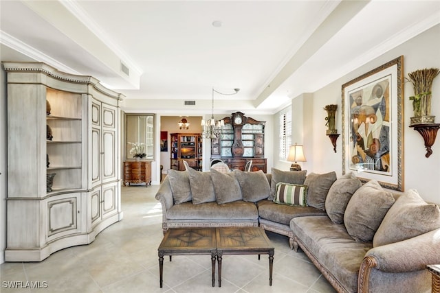 living room featuring ornamental molding, light tile patterned floors, and a notable chandelier