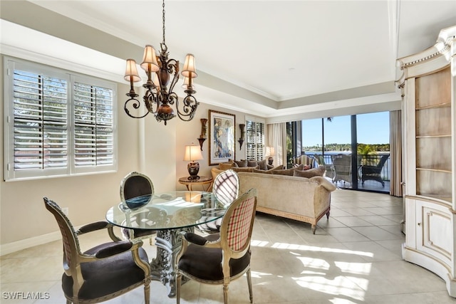 dining area with an inviting chandelier, crown molding, and light tile patterned flooring