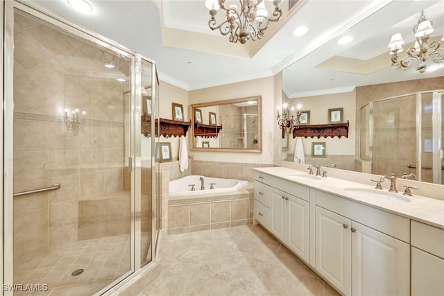 bathroom featuring ornamental molding, separate shower and tub, and a chandelier