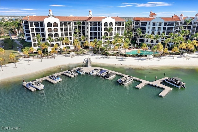 drone / aerial view with a beach view and a water view