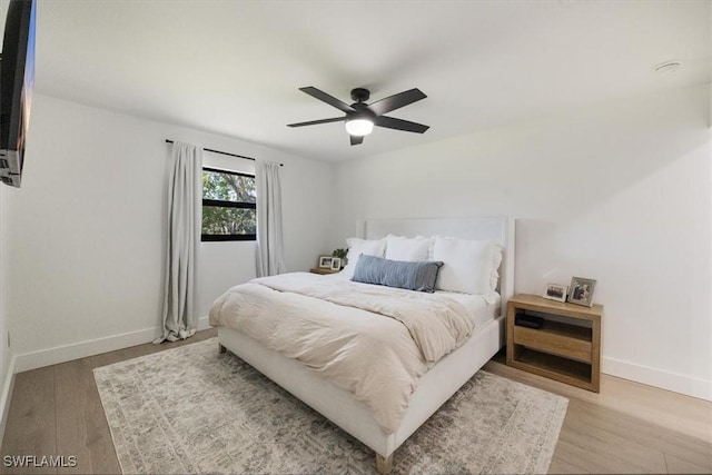 bedroom featuring ceiling fan and light wood-type flooring