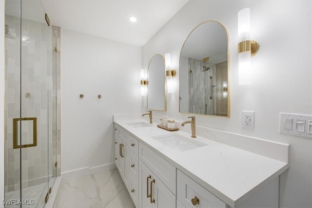 bathroom featuring vanity and a shower with shower door