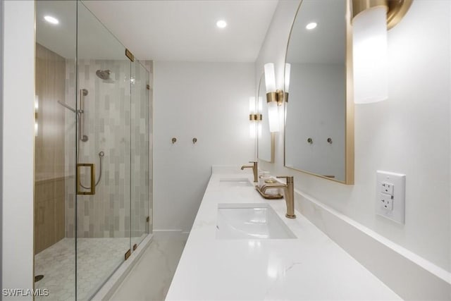 bathroom with an enclosed shower and vanity