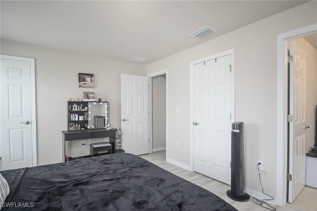 bedroom featuring light wood-type flooring