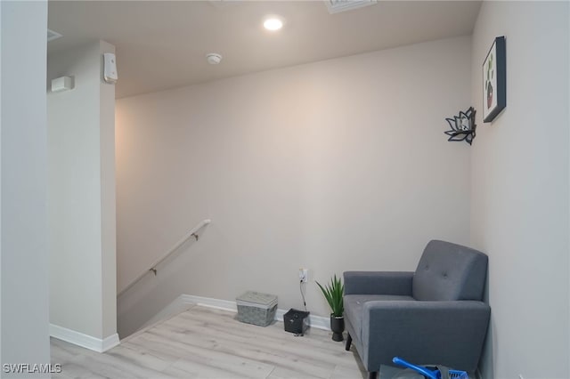 living area with light hardwood / wood-style floors