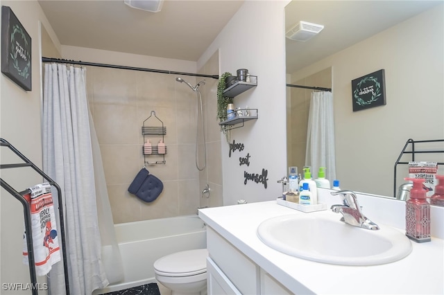 full bathroom with vanity, shower / tub combo, and toilet