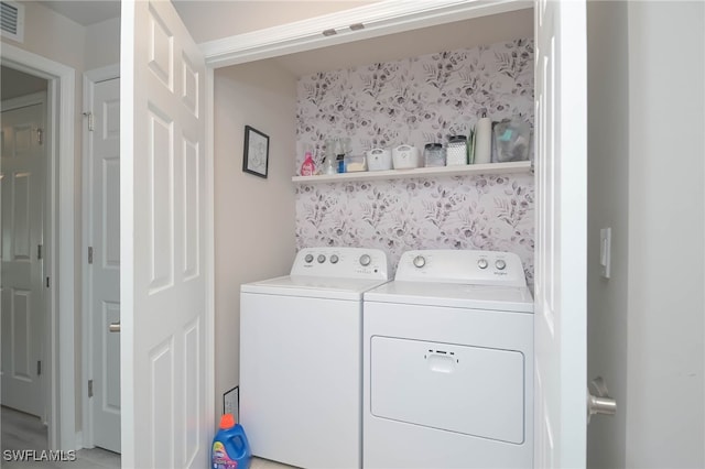 laundry area with separate washer and dryer