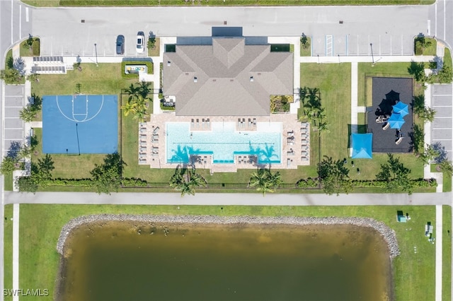 birds eye view of property with a water view