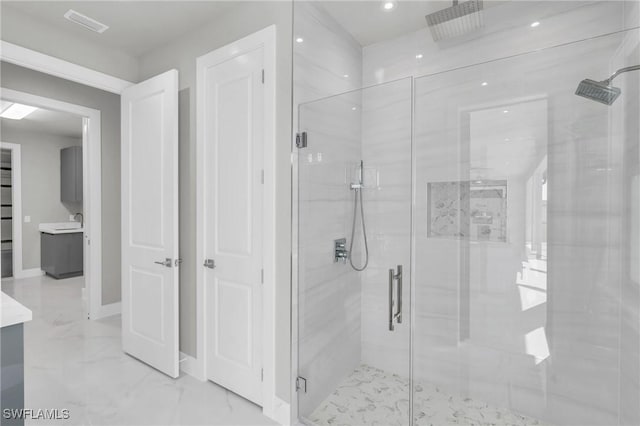 bathroom with a shower with door