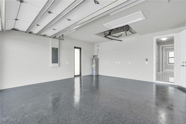 garage featuring electric panel and water heater