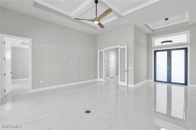 interior space featuring a towering ceiling, coffered ceiling, ceiling fan, and french doors