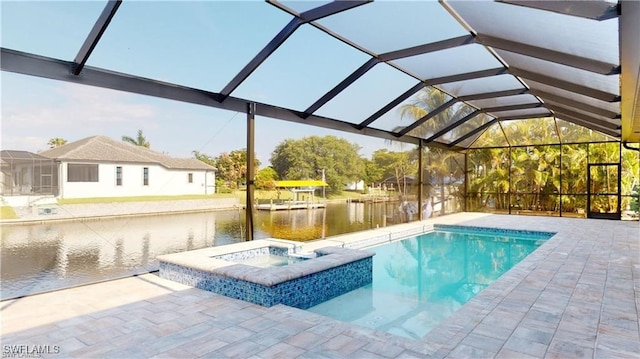 view of pool with a water view, a patio, an in ground hot tub, and glass enclosure