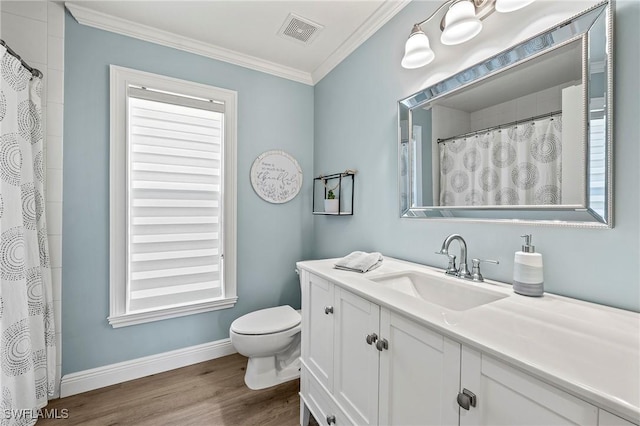 bathroom with hardwood / wood-style flooring, ornamental molding, toilet, and vanity