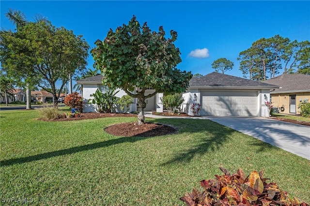 view of front of house with a garage and a front yard