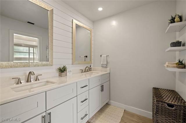 bathroom with vanity and hardwood / wood-style floors