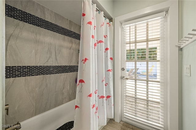 bathroom with shower / tub combo with curtain