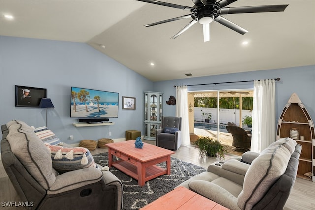 living area with a ceiling fan, lofted ceiling, visible vents, and light wood finished floors