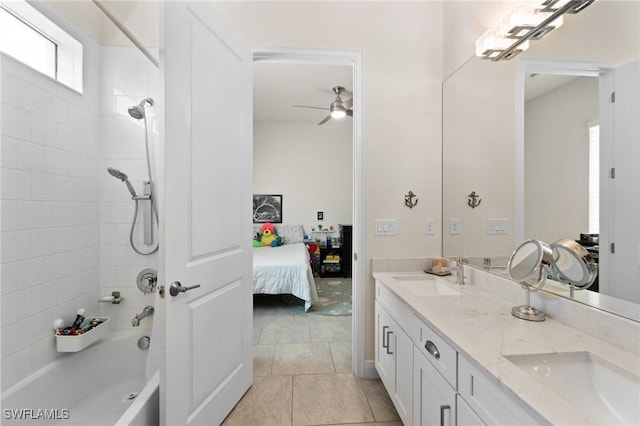 bathroom with vanity, tiled shower / bath combo, tile patterned floors, and ceiling fan