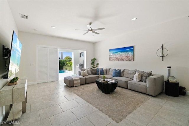 tiled living room featuring ceiling fan