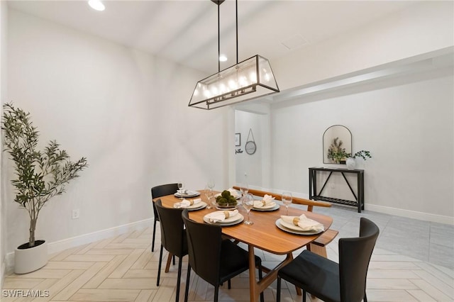 dining room featuring light parquet flooring