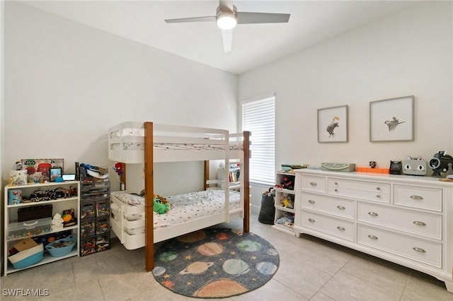 tiled bedroom featuring ceiling fan