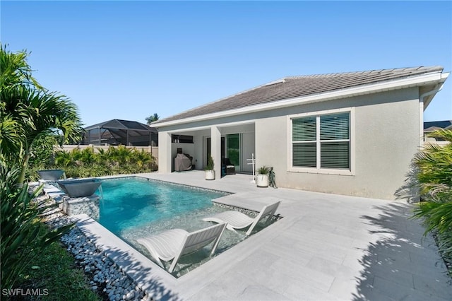 view of swimming pool with a patio area and pool water feature