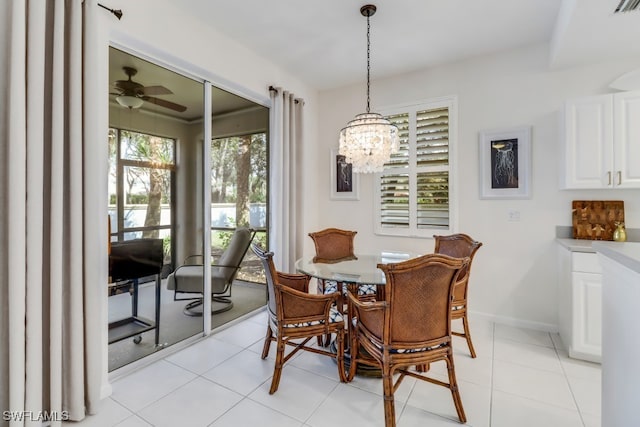 dining space with light tile patterned floors and ceiling fan