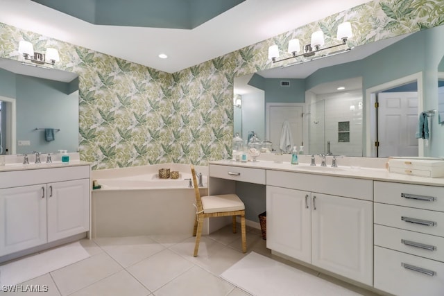 bathroom with tile patterned flooring, vanity, and independent shower and bath