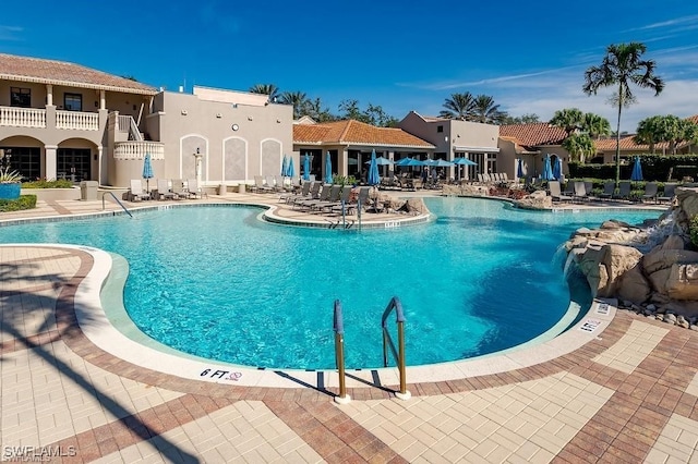 view of swimming pool featuring a patio area