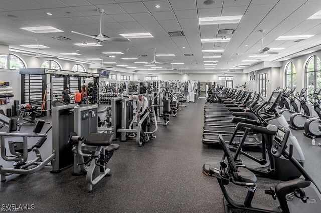 gym with a paneled ceiling