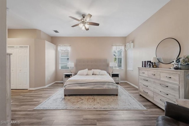 bedroom featuring hardwood / wood-style floors and ceiling fan