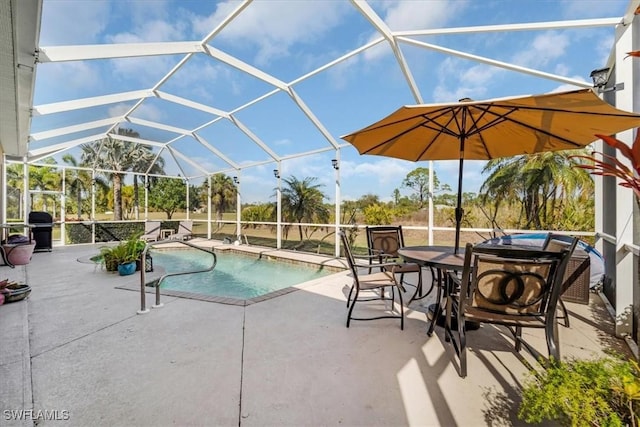 view of swimming pool featuring area for grilling, a lanai, and a patio area