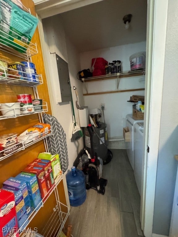 storage area with separate washer and dryer and electric panel