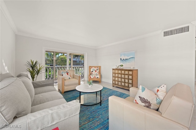 living area featuring ornamental molding, wood finished floors, and visible vents