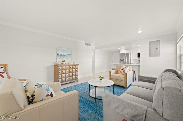 living room with crown molding, recessed lighting, visible vents, electric panel, and baseboards