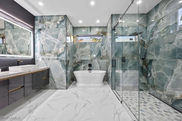 bathroom with vanity, independent shower and bath, and tile walls