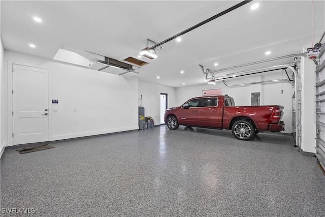 garage featuring a garage door opener and electric panel