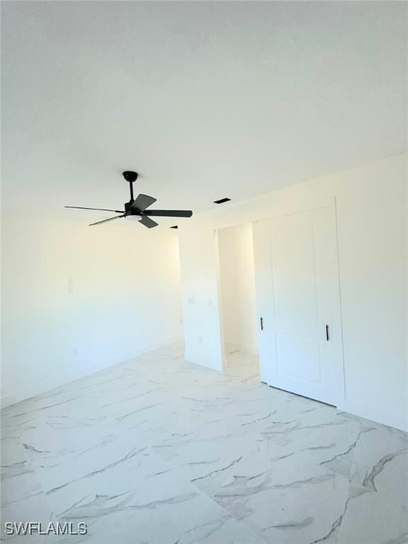 spare room featuring ceiling fan