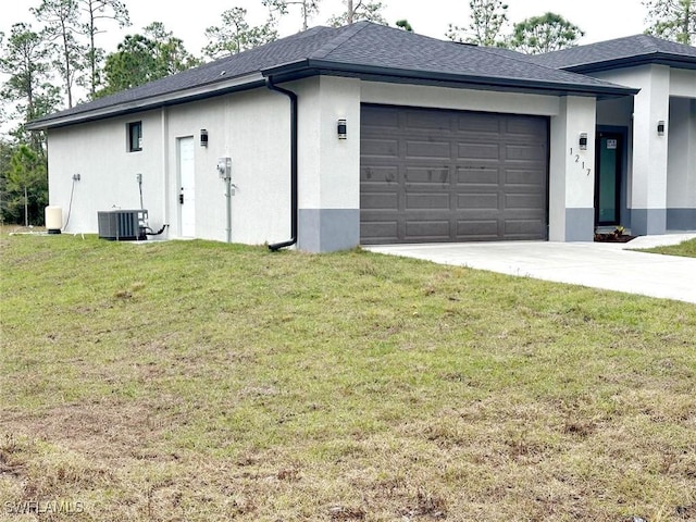 garage featuring central AC and driveway