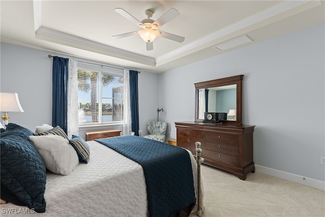 bedroom featuring light tile patterned floors, a tray ceiling, ornamental molding, and ceiling fan