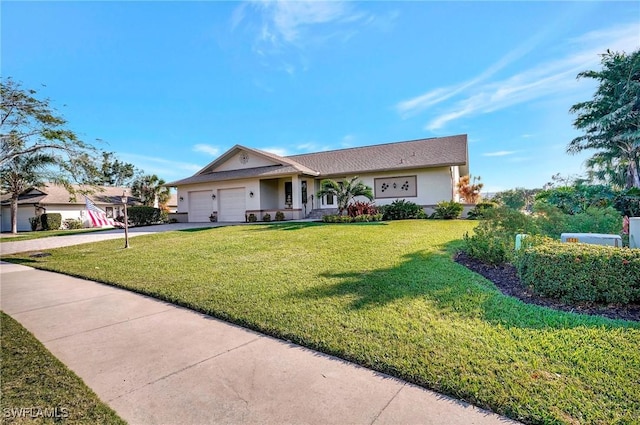 view of front of property with a garage, a front yard, driveway, and stucco siding